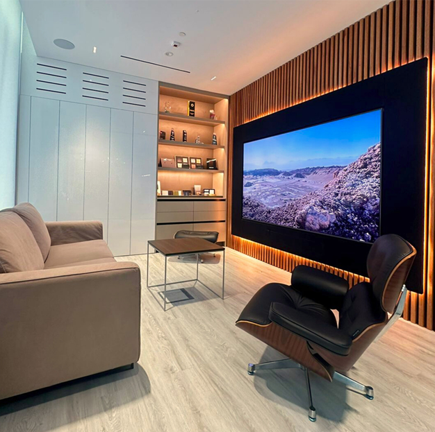 Luxury TV room with large display screen and integrated home entertainment system